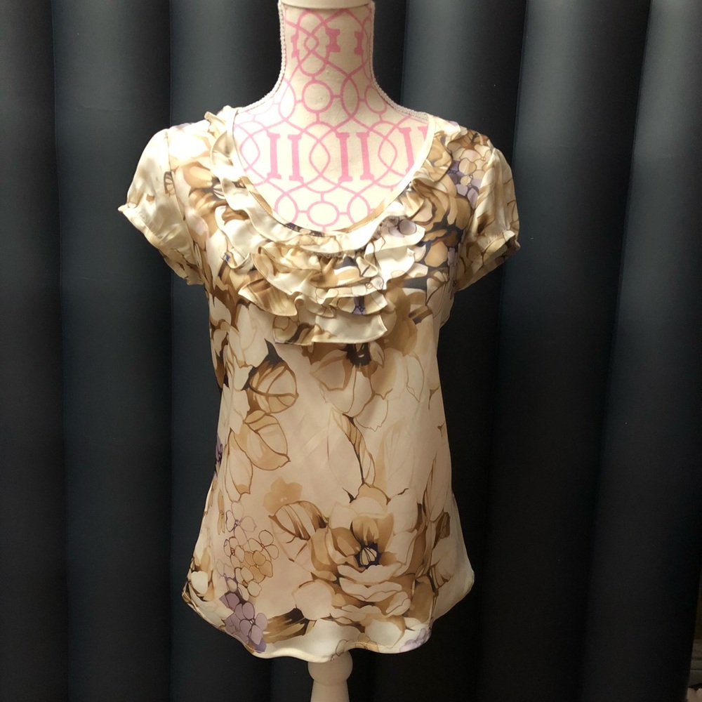 Beautiful 100% polyester cream color floral top.